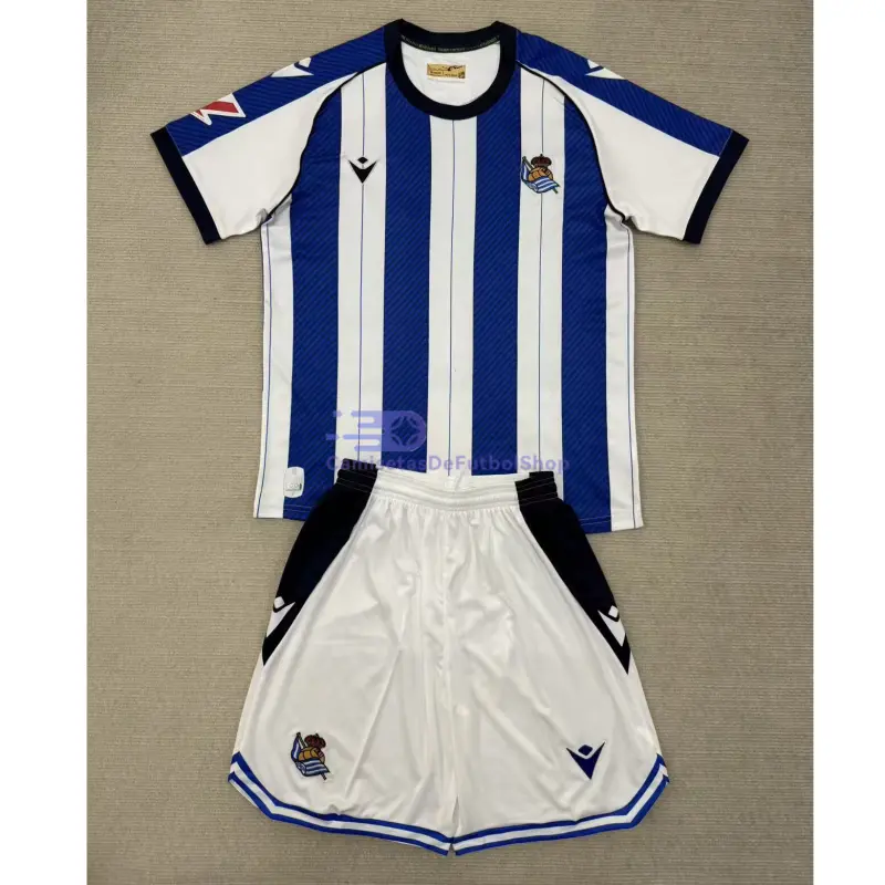 Camiseta Real Sociedad 2025/2026 1ª Equipación  Azul/Blanco Niño Kit con Parche La Liga