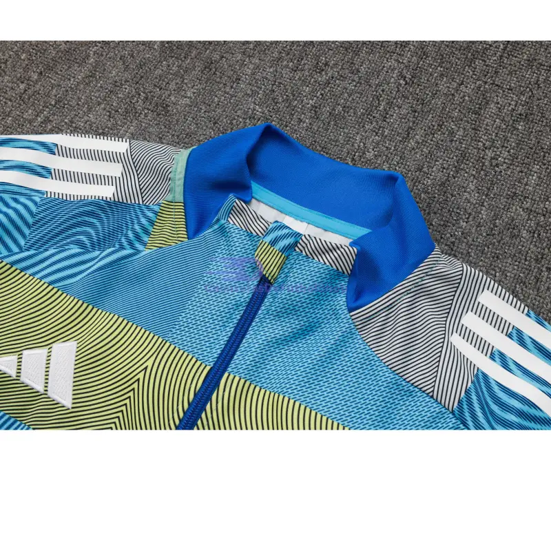 Chandal Real Madrid 2025/2026 en Azul y Verde a Rayas