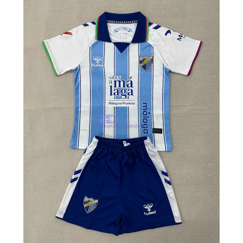 Camiseta Málaga CF 2026/2027 1ª Equipación Azul/Blanco Niño Kit